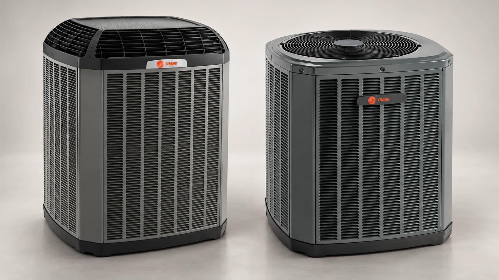 Two dark gray Trane TruComfort outdoor air conditioners shown side by side for a 20 versus 18 comparison